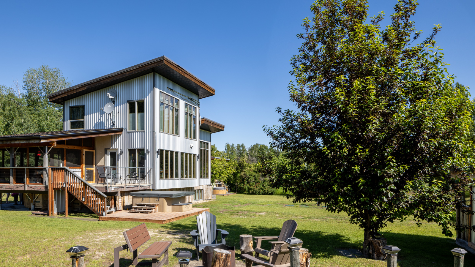 Chairs surround an outdoor firepit outside the Moonraker Mountain Mokki